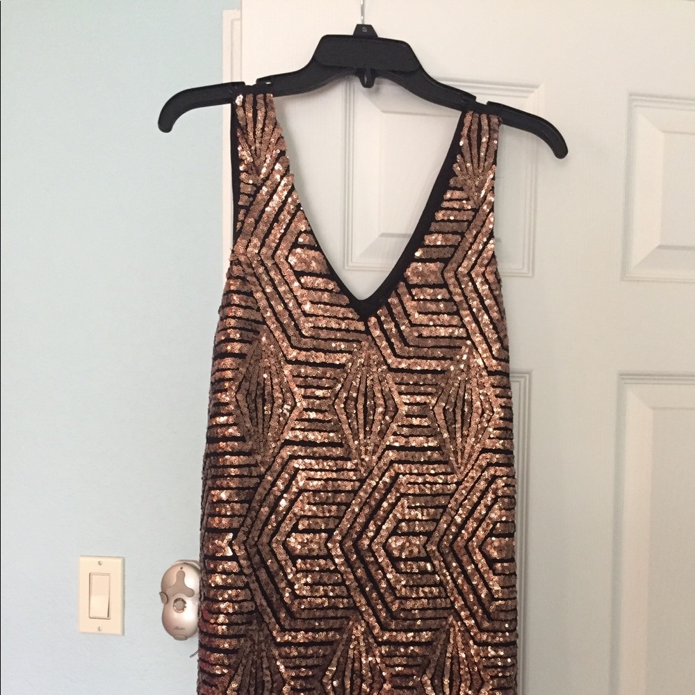 Sequined Art-Deco patterned cocktail dress.